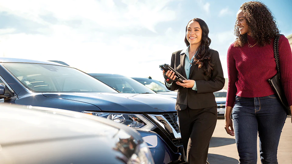 Couple exploring a rental car